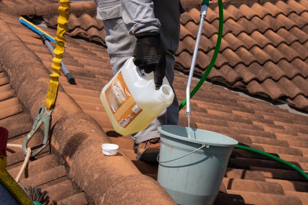 vecteezy a man is cleaning a roof with a bucket and a hose 52503767